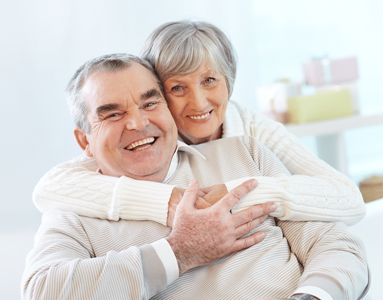 Older couple hugging